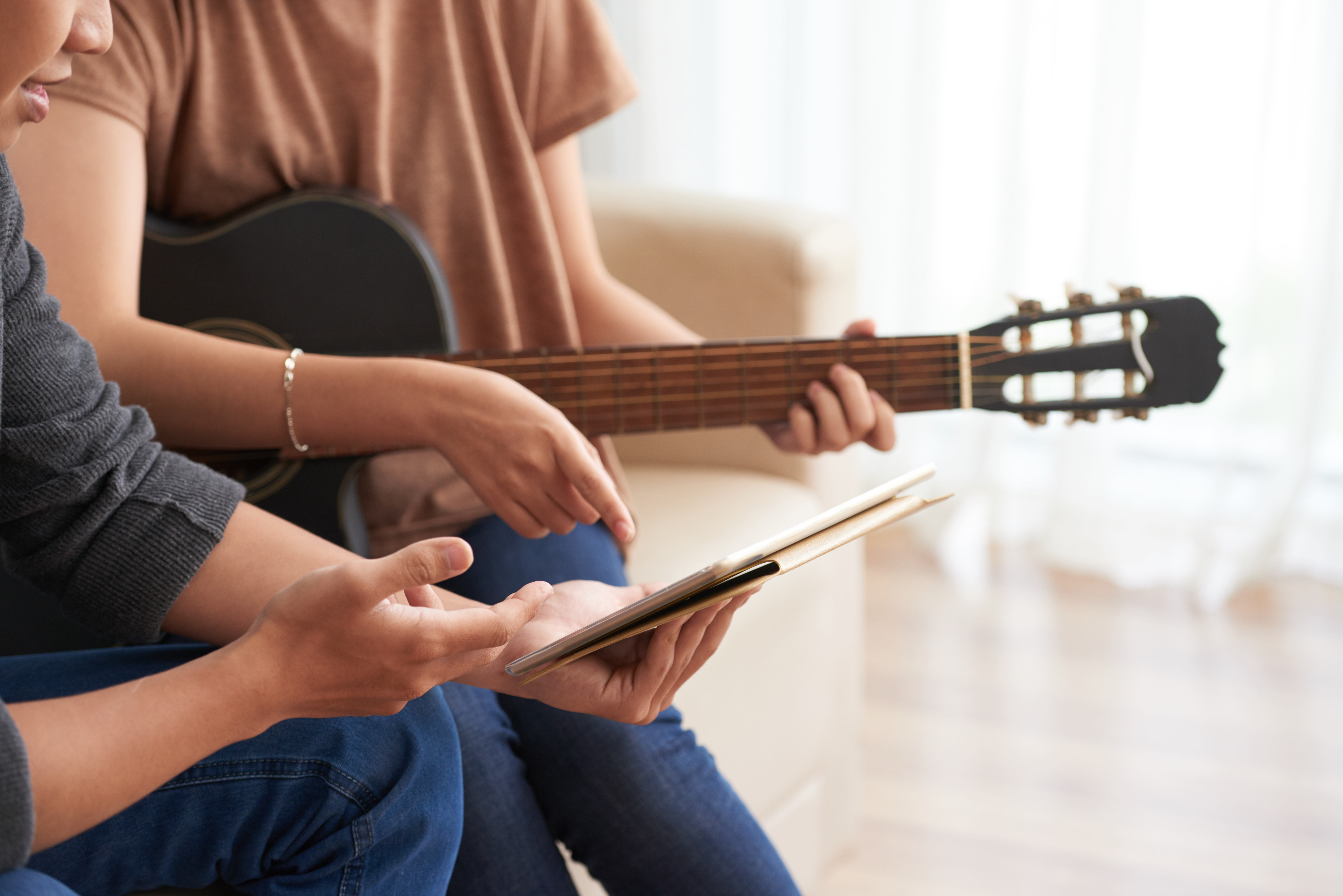 Woman learning guitar